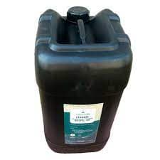 Dark plastic jerrican used for liquid chemical concentrate.