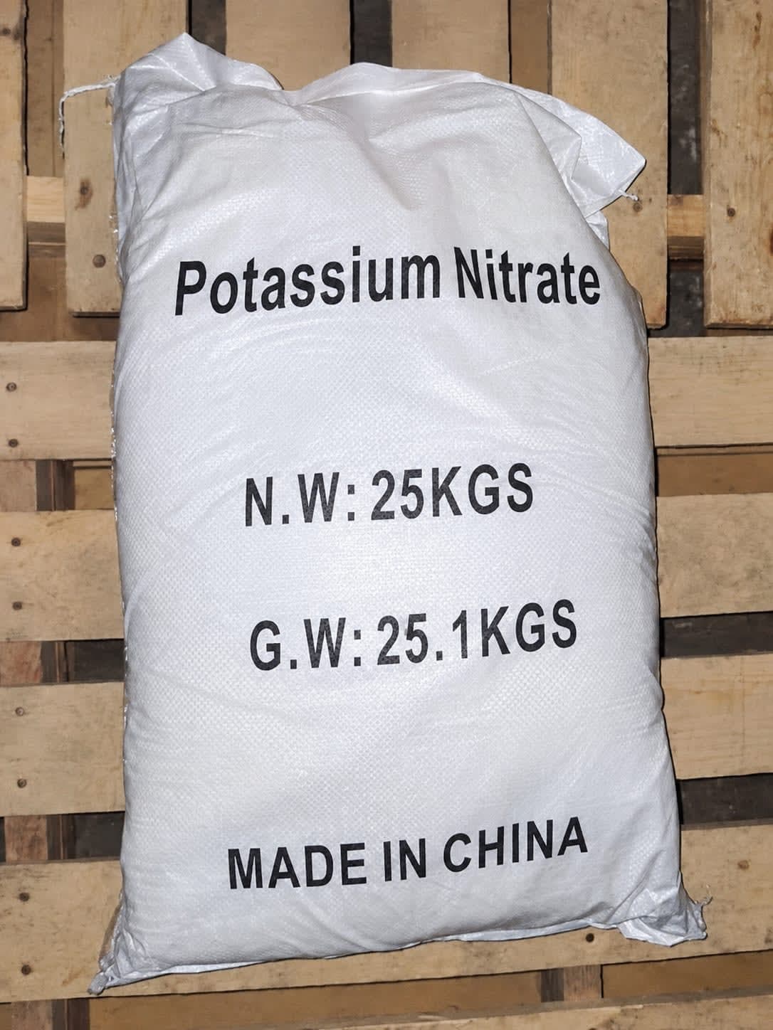 25 kg sack of potassium nitrate on a wooden pallet, made in China.