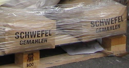 Shrink-wrapped pallet of paper sacks of ground sulphur.