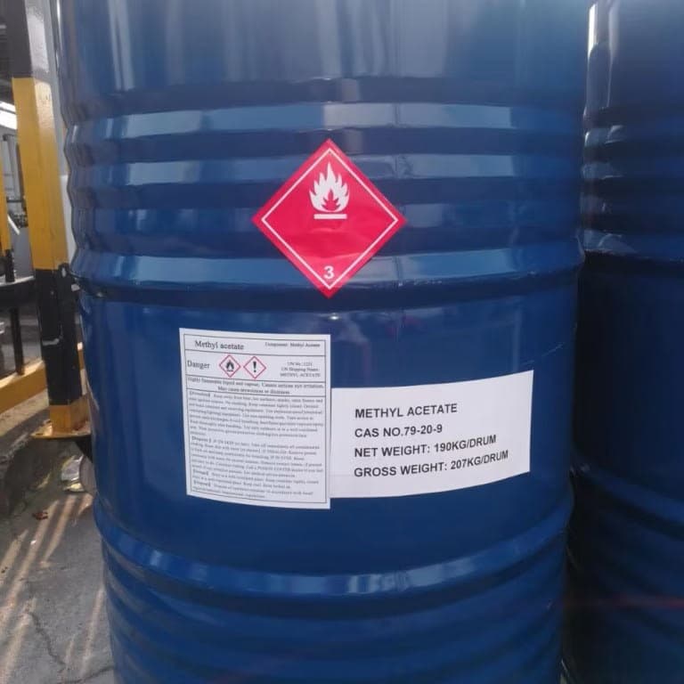 Blue steel drums of methyl acetate, 190 kg each, with flammable-liquid placards.
