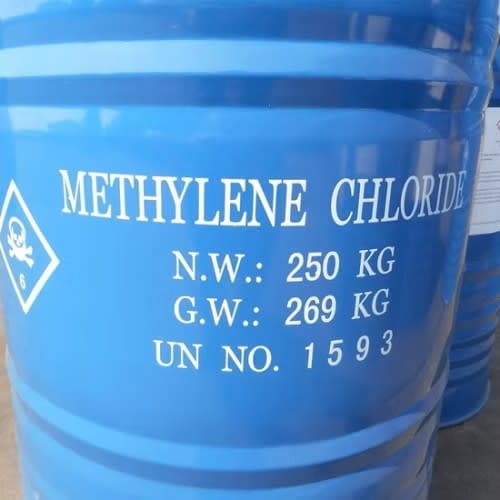 Blue steel drums of methylene chloride, 250 kg net, UN 1593.