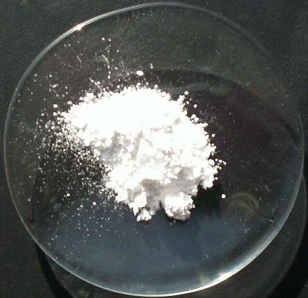 Sample of white magnesium oxide powder.