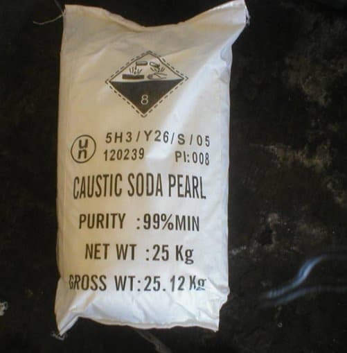 Illustrative supplier sack labelled caustic soda pearl with corrosive hazard symbol